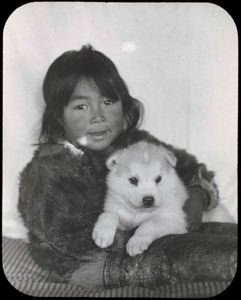 Image of Shoo-e-ging-wah [Suakannguaq Qaerngaaq] with White Puppy